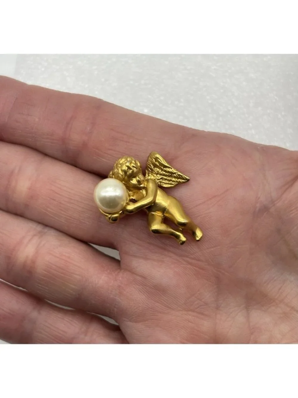 Vintage Avon Angel Cherub Holding Faux Pearl Lapel Pin Matte Gold Tone 3D Signed